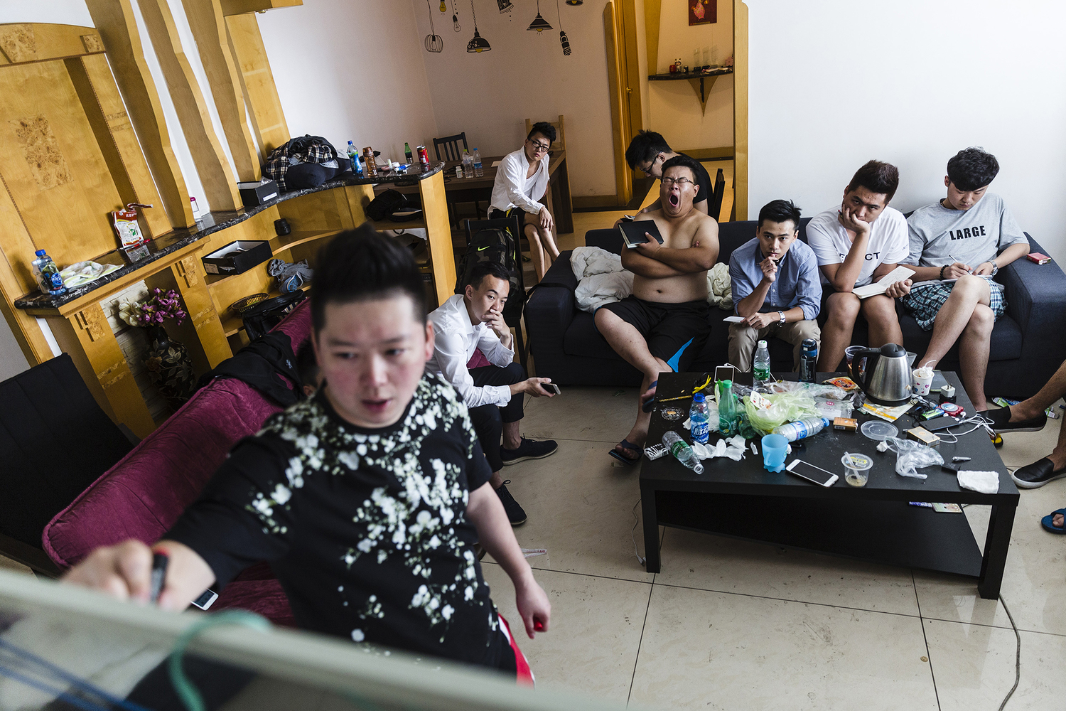 Wang Huanyu founded Puamap, a program that purports to teach its students how to seduce women. He introduces a program on the first day of training, in the three-bedroom apartment where the 12 students and three mentors study and live together, in Chengdu, May 16, 2015. 